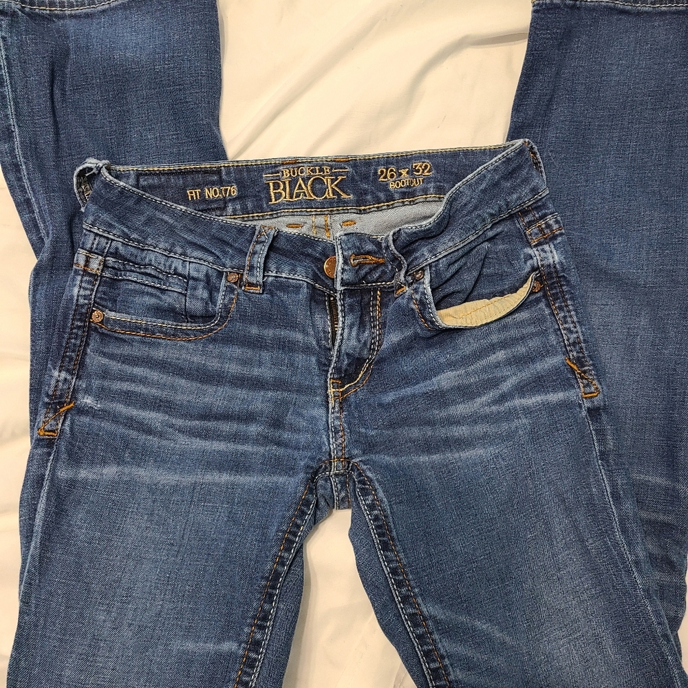 Buckle black jeans 26x32* has hole
